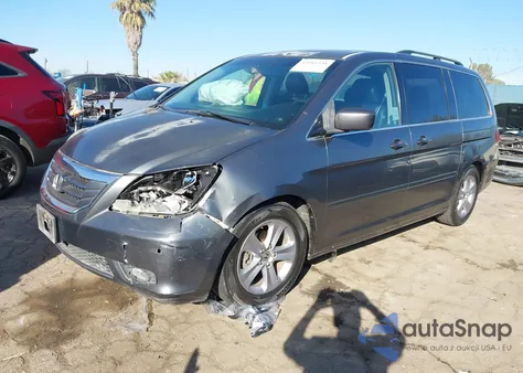 2010 Honda Odyssey Touring z USA, uszkodzony, nr VIN 5FNRL3H98AB053714